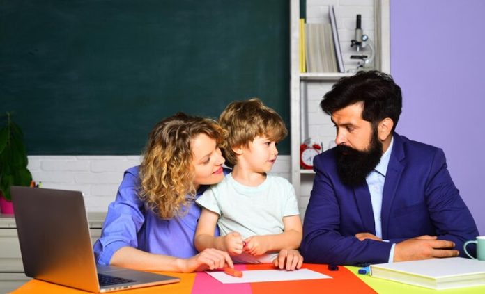 cute-pupil-his-father-mother-making-schooling-work-parenting-first-time-school-school-community-partnership-model-children-education-pupil-education-back-school-home-schooling_378307-10898